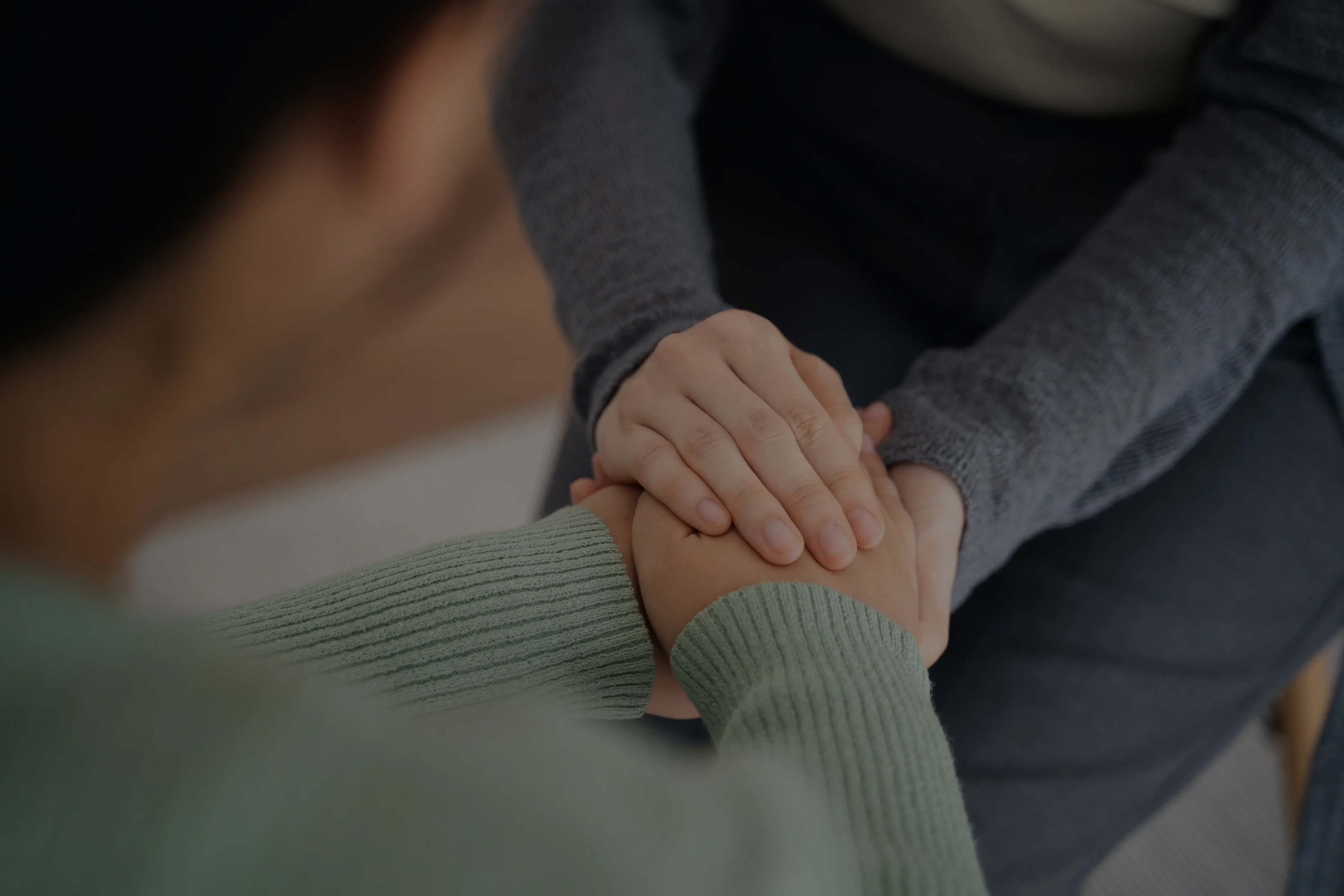 Psychologist, friend or family holding hands to encourage patient with depression, anxiety, therapy session, mental health concept