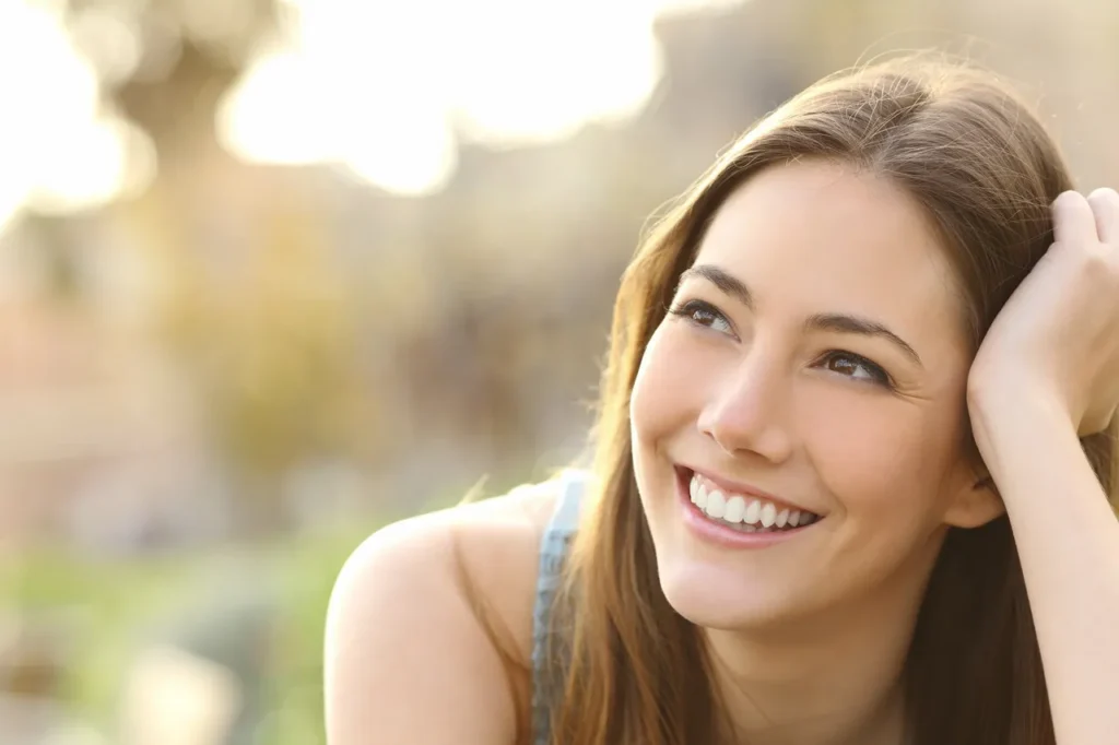 Woman smiling with a thoughtful expression