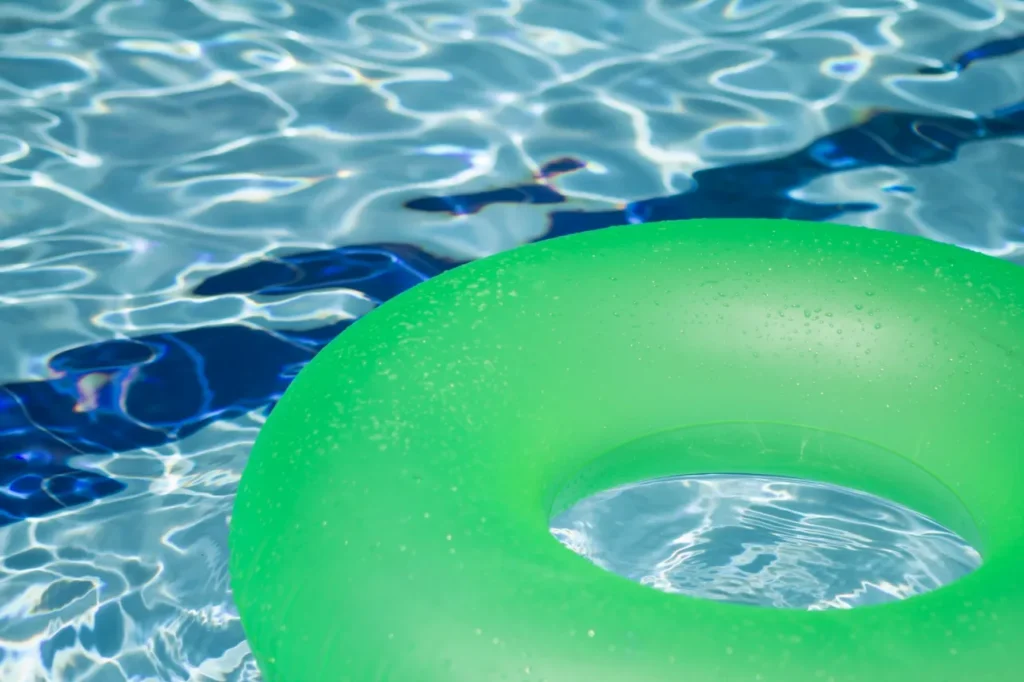 Green pool float in clear water